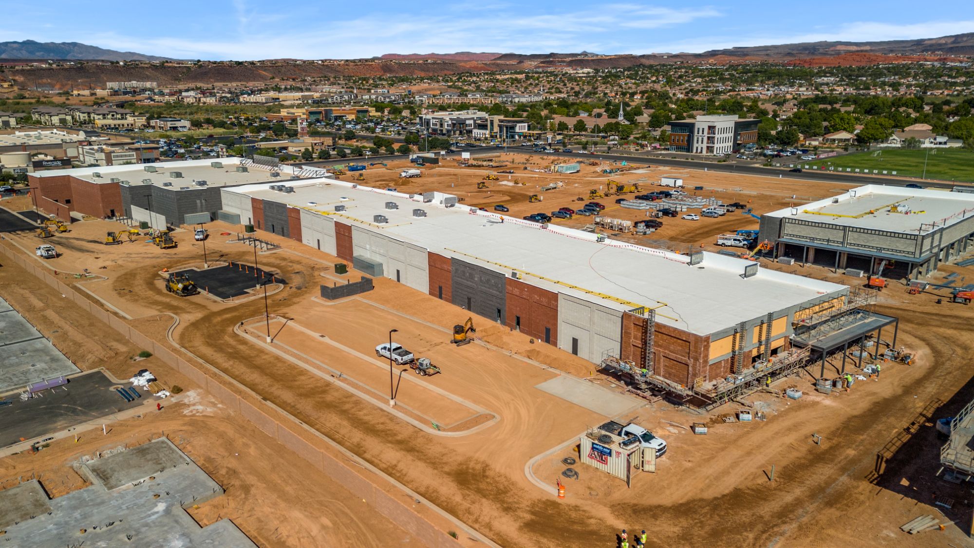 Aerial view of the long retail building under construction at The Paseo, looking toward Riverside