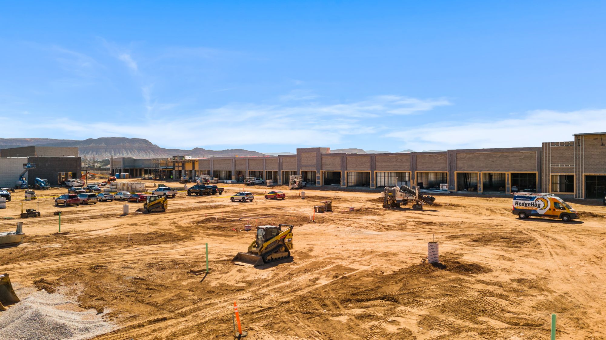 The shop buildings under construction at The Paseo, seen from the graded parking field